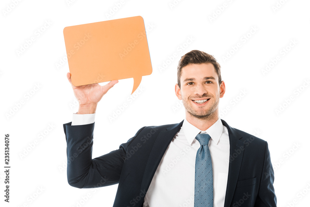 smiling businessman in suit holding blank orange speech bubble isolated on white smiling businessman in suit holding blank orange speech bubble isolated on white