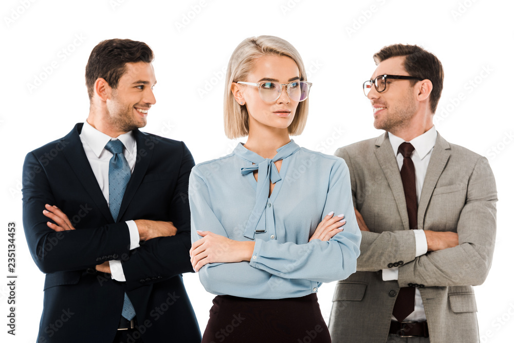 cheerful businessmen standing with arms crossed behind serious businesswoman isolated on white cheerful businessmen standing with arms crossed behind serious businesswoman isolated on white