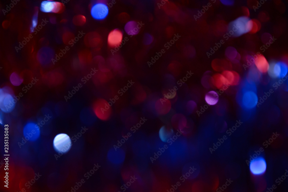 Bokeh. Holiday background. Christmas lights. Glitter. Defocused sparkles. New Year backdrop. Festive wallpaper. Blinks. Carnival. Bokeh retro style photo. Violet. Red. Blue. Bokeh. Holiday background. Christmas lights. Glitter. Defocused sparkles. New Year backdrop. Festive wallpaper. Blinks. Carnival. Bokeh retro style photo. Violet. Red. Blue.