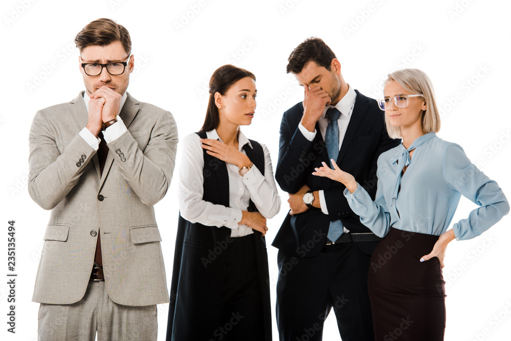 guilty worried businessman with colleagues behind isolated on white