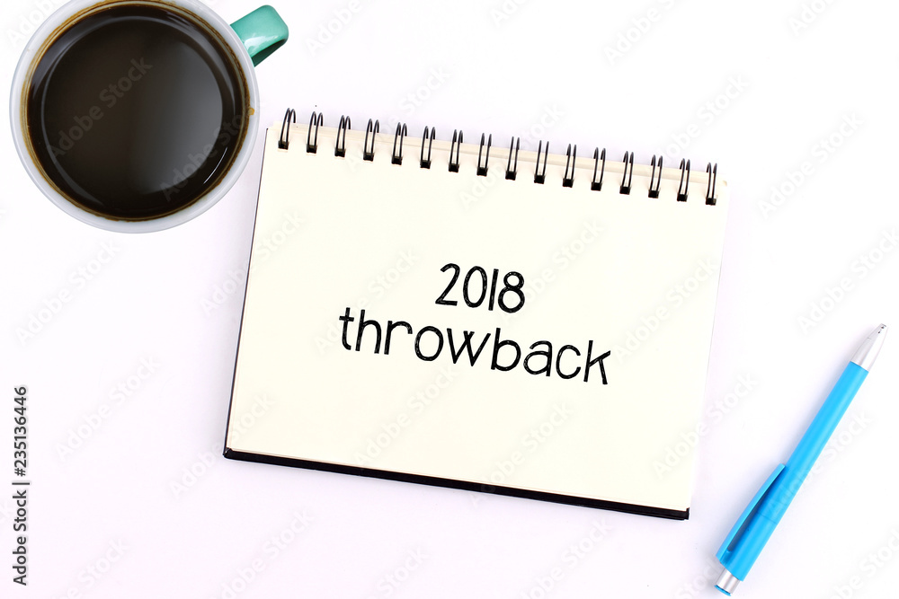 Business concept. top view notebook with coffee cup and pen writing 2018 Throwback Business concept. top view notebook with coffee cup and pen writing 2018 Throwback