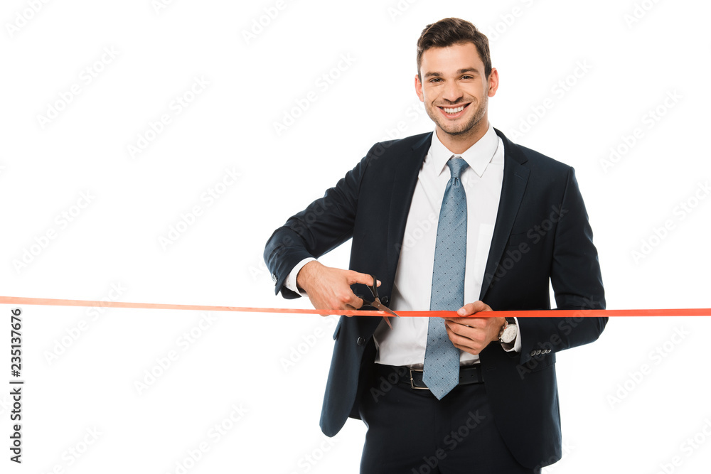handsome businessman cutting red ribbon with scissors on opening ceremony, isolated on white handsome businessman cutting red ribbon with scissors on opening ceremony, isolated on white