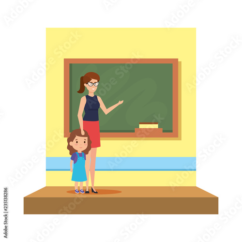 female teacher with girl in the classroom