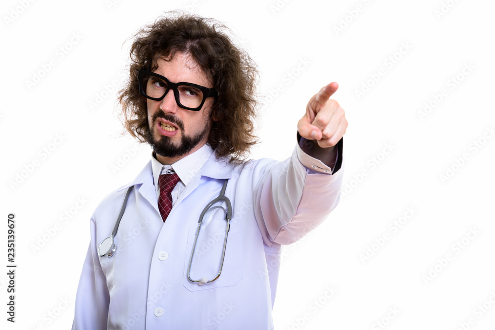 Studio shot of angry man doctor pointing finger at distance Studio shot of angry man doctor pointing finger at distance