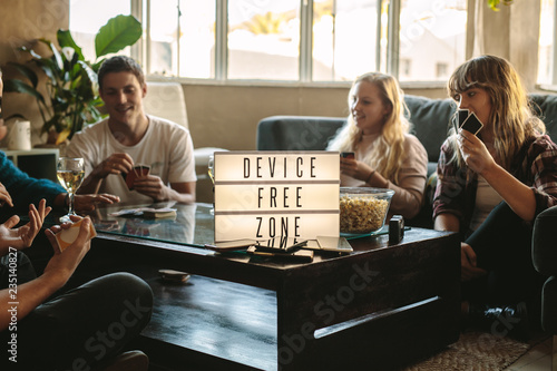 Digital detox - Friends playing cards at device free zone