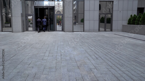 Wallpaper Mural Employees going into business center visiting partners in office time-management Torontodigital.ca