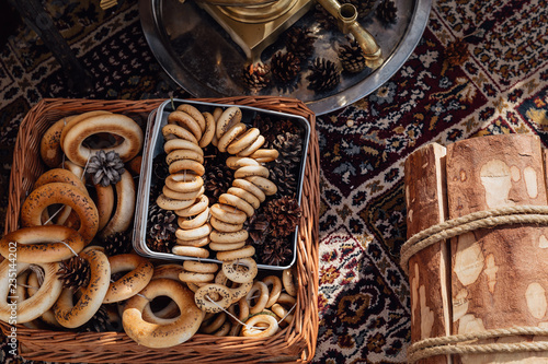 Russian bagels in a basket with fir cones