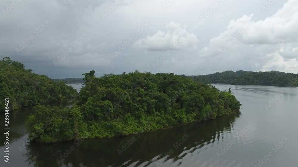 Aerial flight over a small island in a man made lake. Petit saut dam reservoir. Aerial flight over a small island in a man made lake. Petit saut dam reservoir.