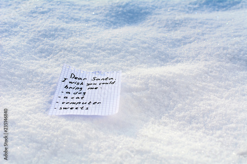 letter to Santa a wish list in the snow. Christmas and New Year holidays concept