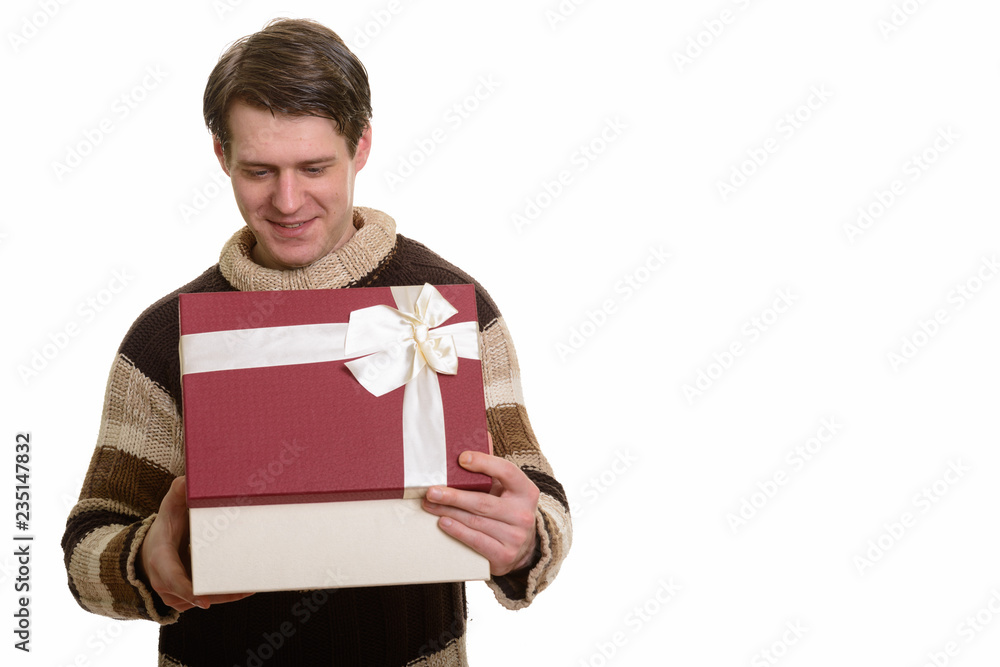 Happy handsome Caucasian man opening gift box ready for Valentin Happy handsome Caucasian man opening gift box ready for Valentin