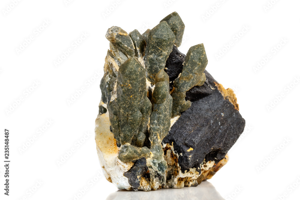 Macro mineral stone Quartz Hedenbergite Prase on ilvite on a white background Macro mineral stone Quartz Hedenbergite Prase on ilvite on a white background