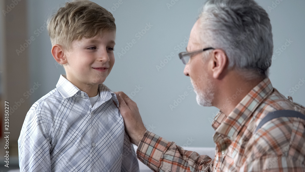 Grandpa giving advice to boy, teaching younger generation, sharing experience Grandpa giving advice to boy, teaching younger generation, sharing experience