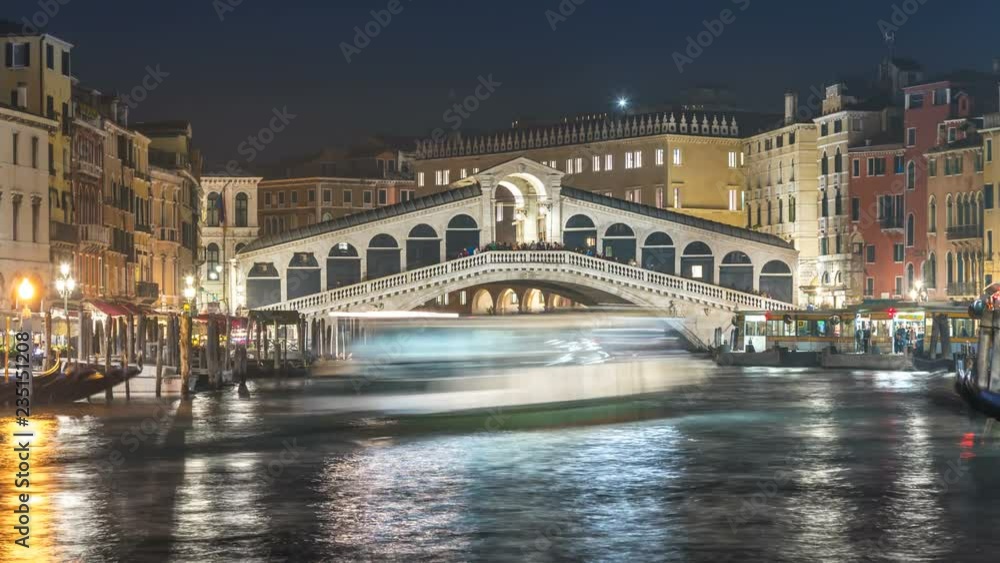 Venice Ponte di Rialto Bridge at night Timelape, Gondolas, ships in Grand canal in front of Bridge Ralto, Italy. Venice Ponte di Rialto Bridge at night Timelape, Gondolas, ships in Grand canal in front of Bridge Ralto, Italy.