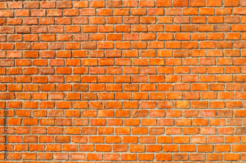 Rectangular orange bricks random pattern wall facade. orange brick wall seamless pattern texture background 