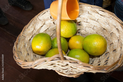 fruit in basket on wooden table