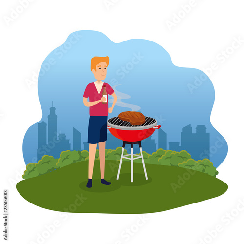 man cooking in bbq grill in the park
