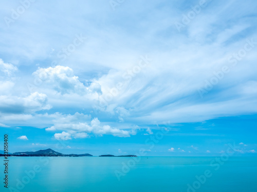 Seascape view under cloudy blue sky