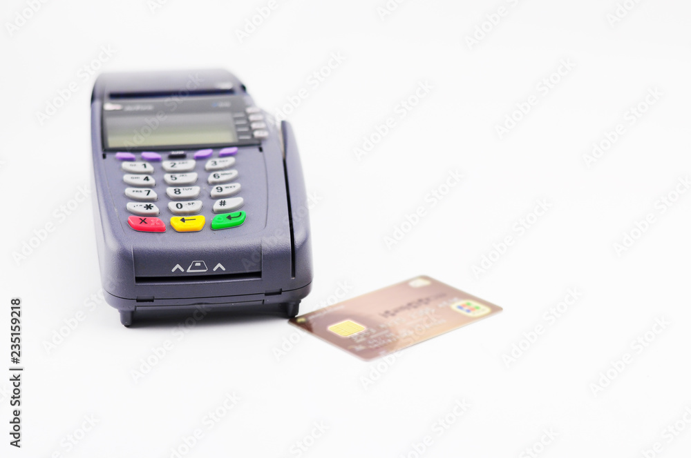 Credit card reader machine and smart card on white background Credit card reader machine and smart card on white background