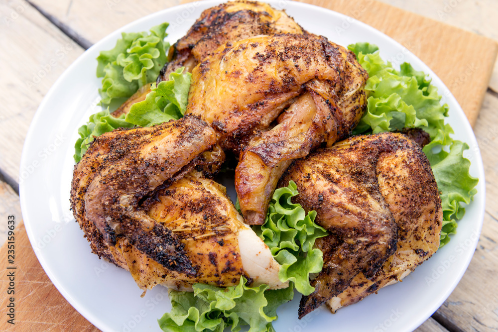 Dish with pieces of grilled chicken with salad Dish with pieces of grilled chicken with salad