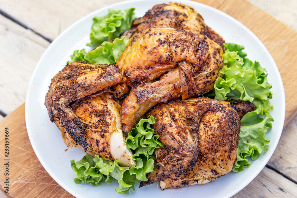 Dish with pieces of grilled chicken with salad Dish with pieces of grilled chicken with salad