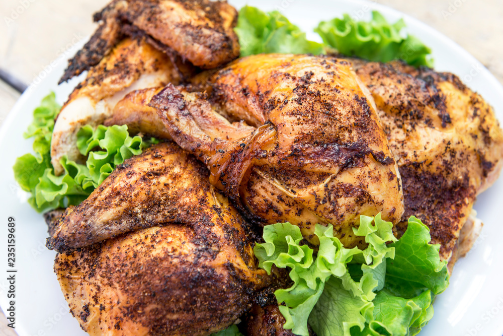 Dish with pieces of grilled chicken with salad Dish with pieces of grilled chicken with salad