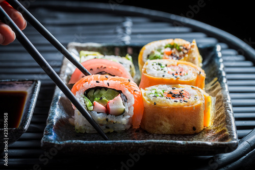 Tasting sushi set made of fresh vegetables and seafood
