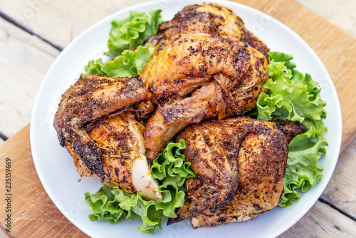 Dish with pieces of grilled chicken with salad