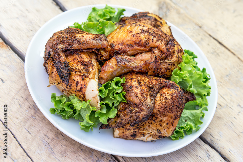 Dish with pieces of grilled chicken with salad Dish with pieces of grilled chicken with salad