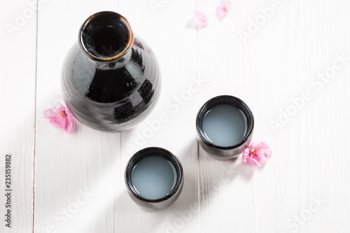 Top view of traditional sake in old black ceramics