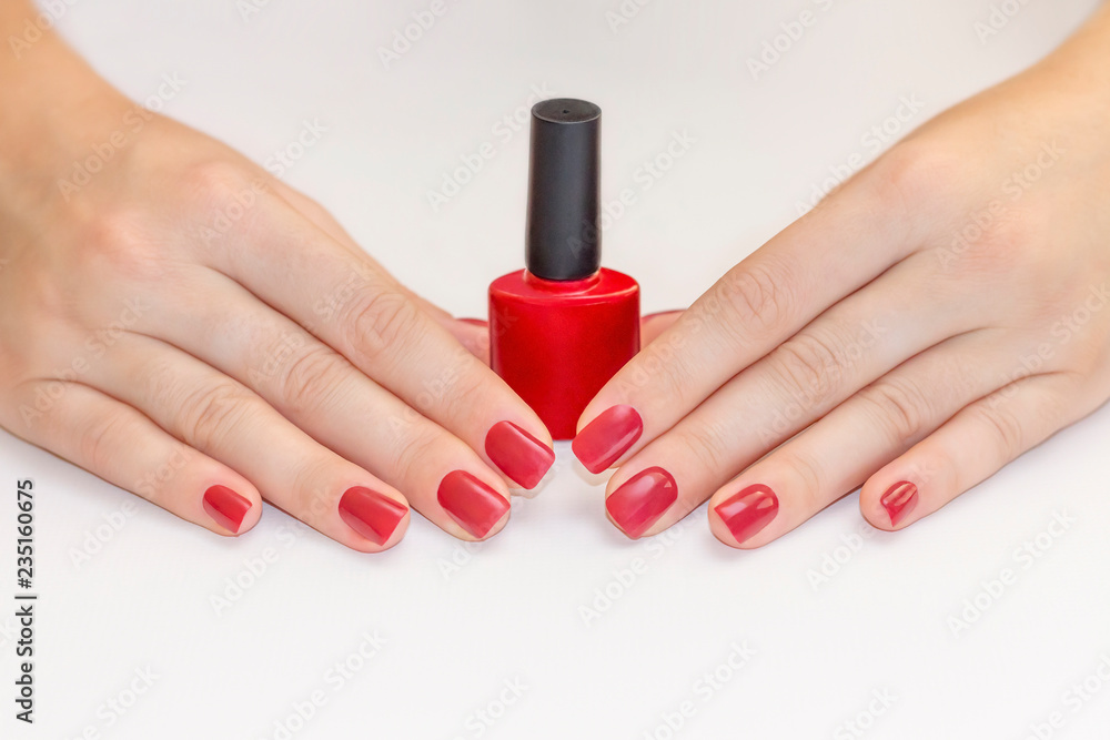 Nails Design with copy space for text. Hands With Red Manicure. Beautiful  female hands with nail polish bottle. beauty concept Stock Photo | Adobe  Stock