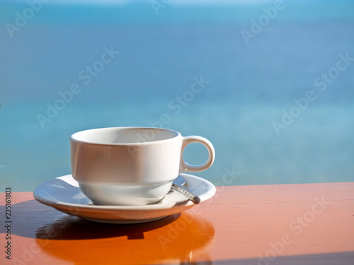 Empty coffee cup at sea side view