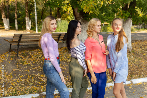 Summer autumn vacation  holidays  travel and people concept - group of young women in the park