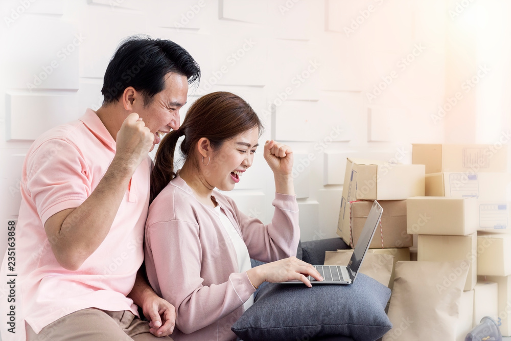 SME Concept; Startup small business entrepreneur SME. Young couple happy success with their smile,online marketing packaging box and delivery. SME Concept; Startup small business entrepreneur SME. Young couple happy success with their smile,online marketing packaging box and delivery.