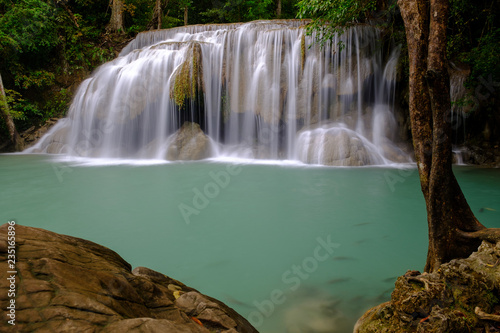 beautiful emerald waterfall and fishes in deep forest in Thailand