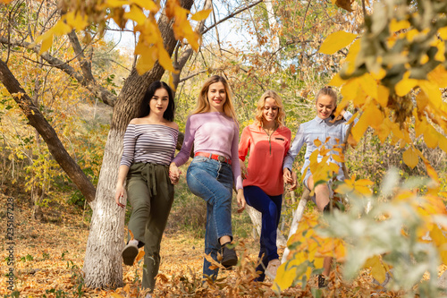 Summer autumn vacation, holidays, travel and people concept - group of young women in the park