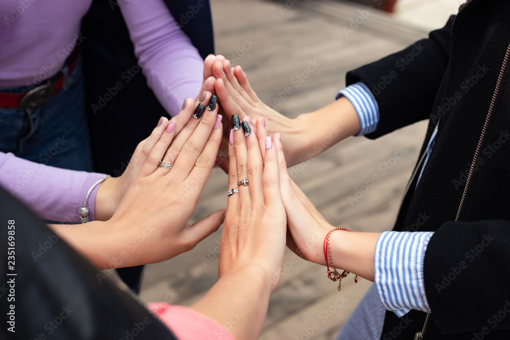 Close up of high five hand gesture, symbol of common celebration or greeting. Success and teamwork concept Close up of high five hand gesture, symbol of common celebration or greeting. Success and teamwork concept