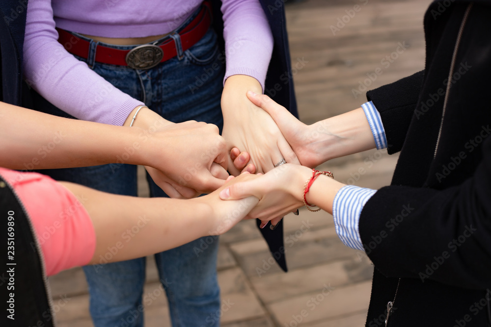 Fototapeta premium Close up of high five hand gesture, symbol of common celebration or greeting. Success and teamwork concept