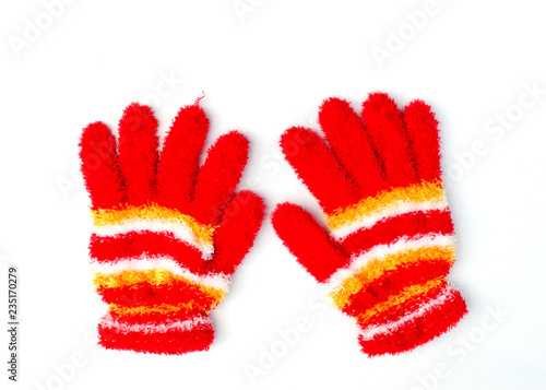 Christmas knitted red gloves isolated on white background above