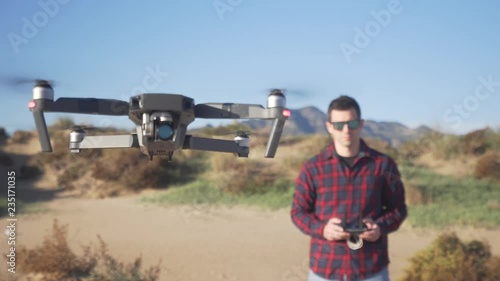 Young man piloting a drone