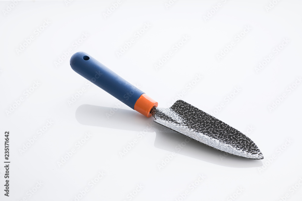 Tools: Close up of a Gardening Trowel Isolated on White Background Shot in Studio. Tools: Close up of a Gardening Trowel Isolated on White Background Shot in Studio.