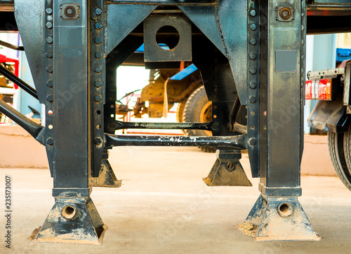 Landing gear on truck. Close up of Landing gear carbon steel on trailer truck or landing legs.  - Truck and trailer parts concepts. 