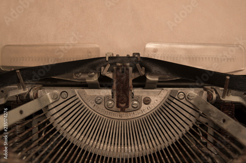 vintage typewriter with a clean sheet of paper. writer, journalism.