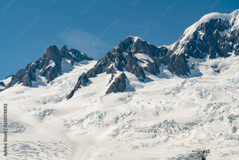 Black rock mountain with snow covered, New Zealand natural landscape background