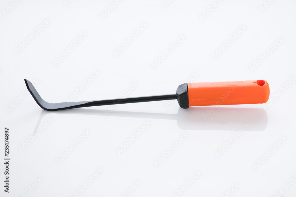 Fototapeta premium Gardening Tools: Close up of a Cape Cod Weeder Isolated on White Background Shot in Studio.
