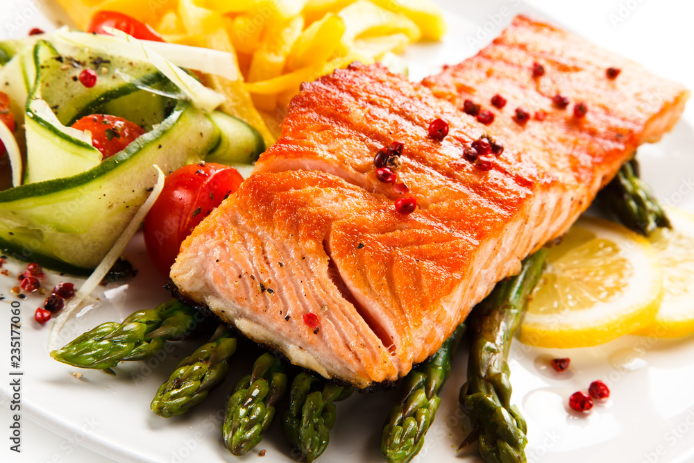 Grilled salmon, French fries and vegetables Grilled salmon, French fries and vegetables