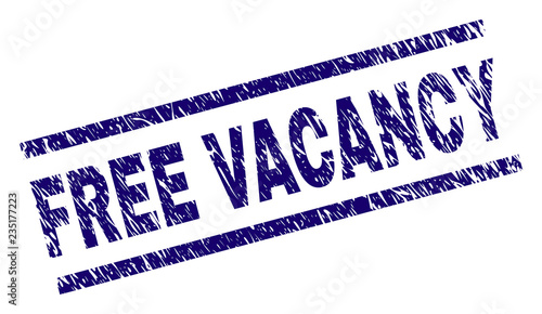 FREE VACANCY seal print with grunge style. Blue vector rubber print of FREE VACANCY title with unclean texture. Text title is placed between parallel lines.