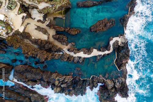 Volcanic lava swimming pool at Porto Moniz, Madeira Island, Portugal photo