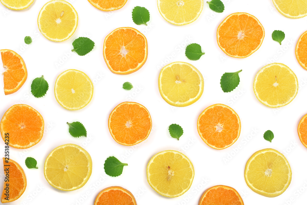 Slices of orange or tangerine and lemon with mint leaves isolated on white background. Flat lay, top view Slices of orange or tangerine and lemon with mint leaves isolated on white background. Flat lay, top view