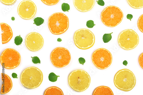 Slices of orange or tangerine and lemon with mint leaves isolated on white background. Flat lay, top view