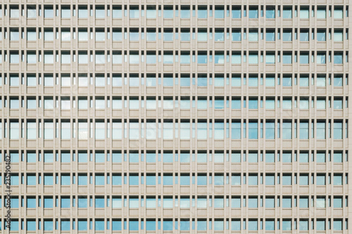 Abstract urban or technology background featuring detail of modern tall office buildings in downtown Tokyo, Japan, with windows textures